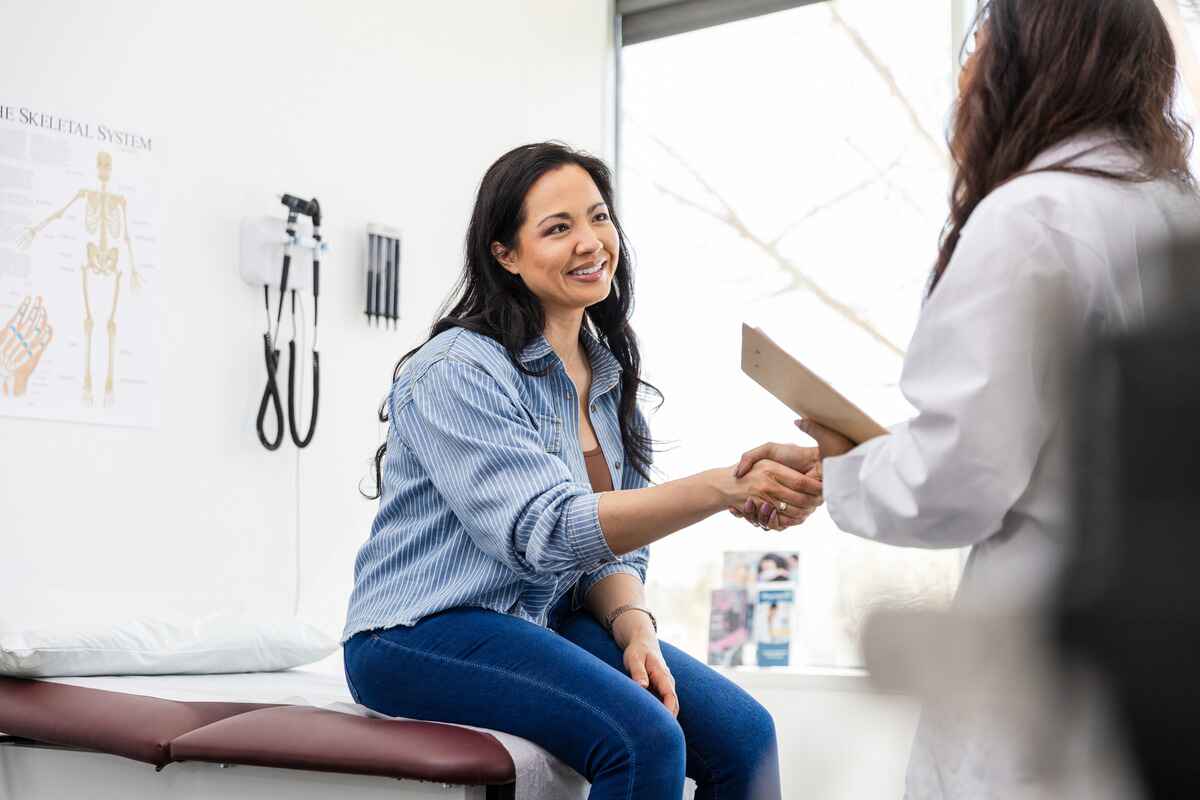 Woman meets doctor at doctor's appointment